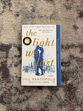 The Light We Lost by Jill Santopolo - White & Blue Paperback